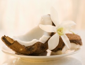 Coconut and Flower on Plate --- Image by © Jamie Grill/Corbis