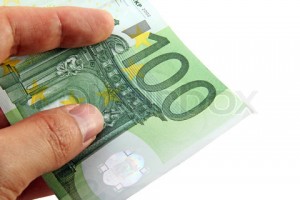 Hand holding a 100 euro bill; including a clipping path