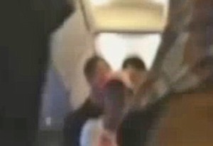 drunk woman escorted off plane singing whitney houston bodyguard I will always love you