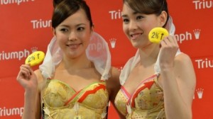 Models from Triumph International display the new "Branomics Bra" on Wednesday in Tokyo.