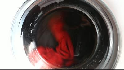 stock-footage-close-washing-machine-clean-colorful-clothes