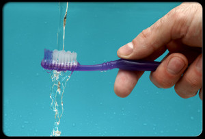 ugly-truth-about-your-toothbrush-s7-photo-of-toothbrush-being-rinsed